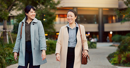 Image showing Walking, conversation and business women in the city talking for communication or bonding. Smile, discussion and professional Asian female people speaking and laughing together commuting in town.