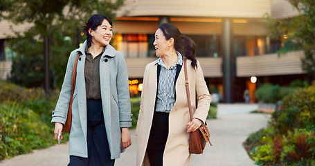 Image showing Walking, conversation and business women in the city talking for communication or bonding. Smile, discussion and professional Asian female people speaking and laughing together commuting in town.