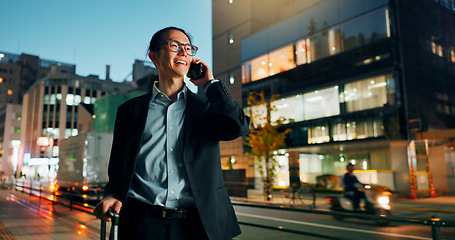 Image showing Businessman, phone call and night in city for conversation, laughing or outdoor travel. Happy asian man or employee smile and talking on mobile smartphone in late evening for discussion in urban town