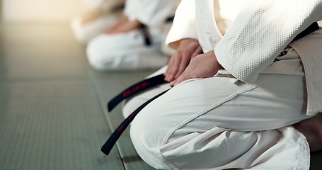 Image showing Japanese men, aikido and bow in training for fighting, modern martial arts and learning self defence. Group, black belt students or instruction in dojo place, sport or class in respect in discipline