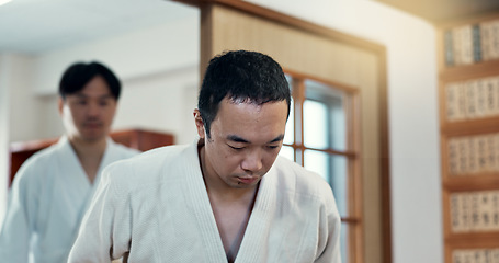 Image showing Bow, karate or people in dojo for martial arts for fitness, discipline or self defense for respect or honor. Kung fu, workout or Asian men walking in training for fighting, wellness or combat sports