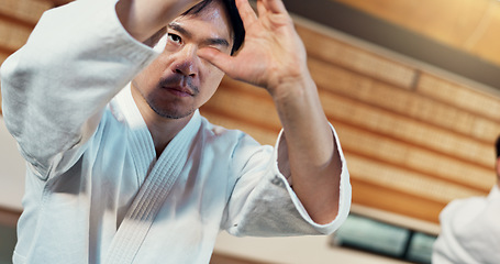 Image showing Learning, karate or Asian man in dojo for kung fu for fitness, discipline or self defense for focus or honor. Training, workout or martial arts students in facility for fighting or combat sports