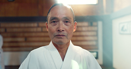 Image showing Sensei, aikido and training dojo for martial arts practice or Japanese traditional sport, fighting or health. Male person, gee uniform and face for fitness challenge or power, champion or confidence