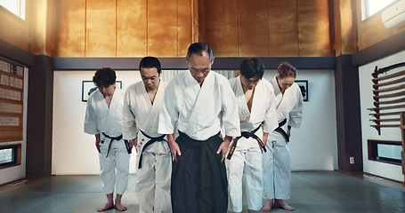 Image showing Martial arts group, men and bow for exercise, respect or honor for fight, conflict or competition in dojo. Senior Japanese sensei, black belt students and aikido with training, workout or discipline