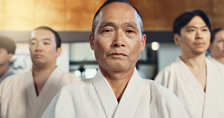 Image showing Japanese man, face and sensei in aikido for respect, honor and dignity with group in martial arts class. Portrait of male person or people in commitment for self defense, training or practice at gym