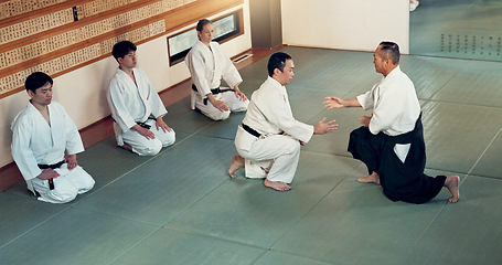 Image showing Aikido, class and fight with a master in martial arts with student in self defence, discipline and training. Technique, demonstration or Japanese sensei with black belt skill in fighting or education