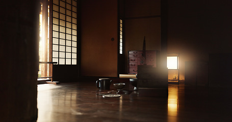 Image showing Interior, tea and floor of house in Japan for tradition, culture or style in dark living room. Empty home, pot and bowl in Tokyo of traditional Japanese style dining, wooden furniture or indoor decor
