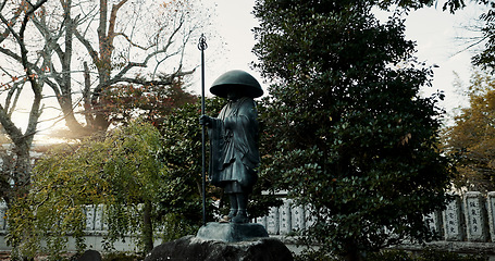 Image showing Japan, warrior and statue in nature or outdoor cemetery for honor, tradition or culture. Structure of old soldier or historical Fushimi Inari Taisha shrine of knight, god or hero for symbol in Kyoto