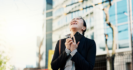 Image showing Businesswoman, cellphone and excited in city street for celebration, achievement or congratulations. Asian person, good news and urban employment or promotion in Tokyo or career, professional or joy