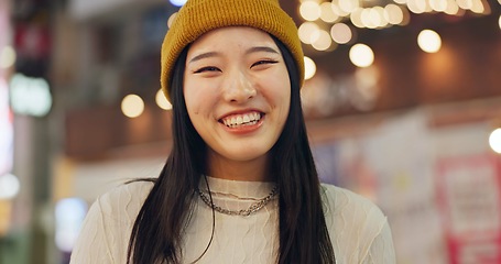 Image showing Woman, Japanese and portrait in street at night for Tokyo travel destination, journey or happy. Female person, face and smile or road city light bokeh for holiday adventurer, vacation or downtown