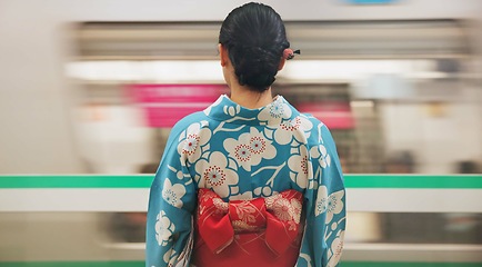Image showing Woman, japan and train station, kimono and travel with public transport, metro bullet in city. Person, journey or traditional clothes in motion blur on weekend or commute in tokyo on adventure