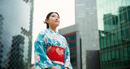 Image showing Thinking, Japanese woman and ideas with city, buildings and opportunity with wonder, relax and travel. Person, outdoor and girl in the streets, choice and calm with peace, commute and thoughts