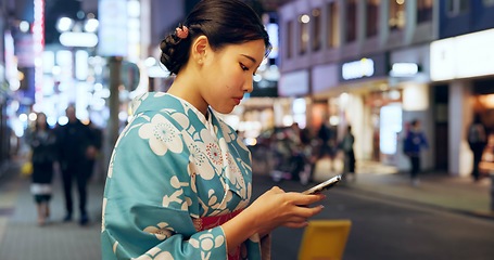 Image showing Street, Japanese woman and smartphone with typing, internet and social media with traditional clothes. Person, outdoor and girl with a cellphone, mobile user and contact with network and digital app