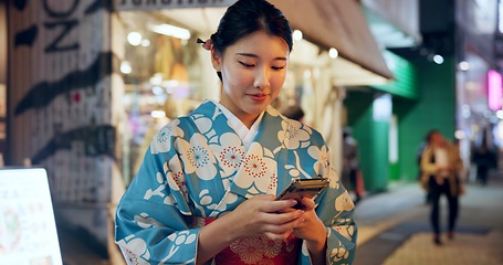 Image showing Street, Japanese woman and cellphone with typing, internet or social media with traditional clothes. Person, outdoor or girl with smartphone, mobile user or contact with network, smile or digital app
