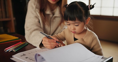 Image showing Mother, child and drawing learning or pencil for home schooling lesson, Japanese or tutor. Female person, girl daughter and book paper in Tokyo or writing help for art studying, creative or project