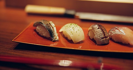 Image showing Tuna, restaurant and japanese sushi for lunch, raw fish and healthy food on plate for asian culture. Japan, cuisine and rice for vitamins on table, soy and nutrition with seafood menu for catering