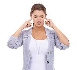 Image showing Noise, stop or woman with fingers in ears in studio for volume control, sensitive or block on white background. Annoyed, frustrated or model with not listening sign, complaint or stressed by tinnitus