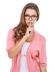 Image showing Portrait, silence and woman with finger on the lips, whisper and model isolated on white studio background. Face, person and girl with noise control, privacy and shush emoji with secret and news