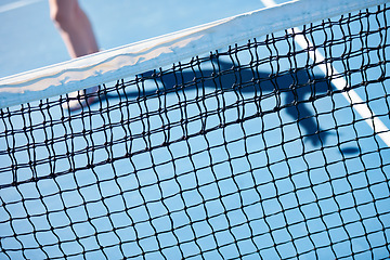 Image showing Tennis court, outdoor or closeup of net with space for mockup, workout or playing in practice. Sports, equipment or athlete in training, arena or fitness exercise at game, contest or competition