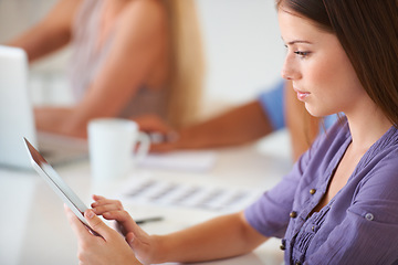 Image showing Tablet, serious and business woman research in office at table, networking and internet app in startup. Technology, creative designer at desk and professional reading email, information and planning