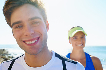 Image showing Couple, outdoor and portrait in beach, workout and fitness with smile, training and sunrise for run. Man, woman and athletic for ocean, sea and exercise together in summer, boyfriend and girlfriend