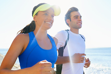 Image showing Happy couple, jog and fitness in beach, workout and active with smile, training and sunrise for run. Man, woman and athletic in ocean, sea and exercise together in summer, morning and health