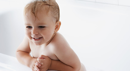 Image showing Face of baby in bath, clean smile or mockup in morning routine for health, wellness or body care in home. Happy toddler washing in bathtub for hygiene, relax and calm child sitting in tub in bathroom