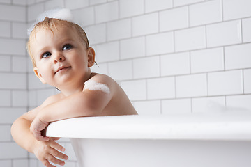 Image showing Kid, baby and child in bath, tub and foam for cleaning, skincare or healthy morning routine at home. Toddler boy, thinking and washing for wellness with soap, bubbles or water for hygiene in bathroom