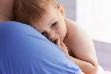 Image showing Parent, comfort and holding baby with calm, sleepy or tired in home with support and care. Person, love and carry child in arms bonding with kindness in bedroom and infant with trust in family
