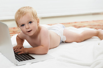 Image showing Baby, playing and learning on laptop in portrait on bed at home with online games for education. Happy, child and relax with cartoon, movies or development of knowledge of technology for growth