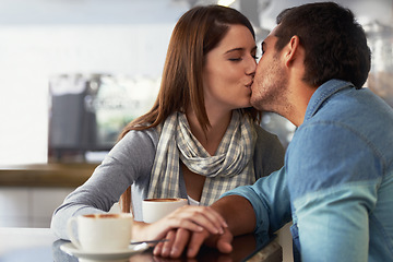 Image showing Love, kiss and couple in coffee shop, cafe and bonding together on valentines day date. Romance, man and woman in restaurant with latte drink, connection and care in healthy relationship commitment