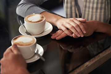 Image showing Coffee cup, cafe and relax couple holding hands for support, empathy and care on morning date with caffeine beverage. Relationship, hospitality service and closeup of people bonding over drink mug