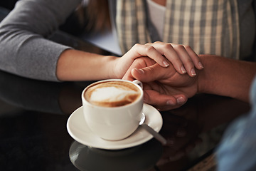 Image showing Coffee cup, cafe and relax couple holding hands for support, comfort or love on morning date with caffeine beverage. Wellness, marriage partner or closeup of people bonding over restaurant drink