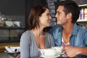 Image showing Smile, shop and couple drinking coffee in cafe, care and bonding together on valentines day date. Happy, man and woman in restaurant with latte for love connection, conversation and relationship