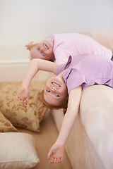 Image showing Portrait of happy kids, sisters or upside down on couch for love, bond and care for trust or support. Friends, family home or girl siblings in lounge together to play games with freedom and smile