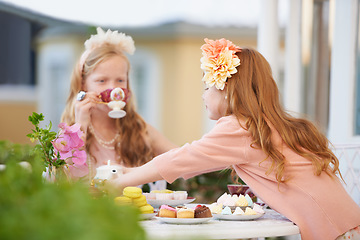 Image showing Girls, children and friends at tea party outdoor for fantasy play in garden for cake, birthday or game. Kids, youth and fancy dress up in nature for summer bonding in backyard, beverage or preschool