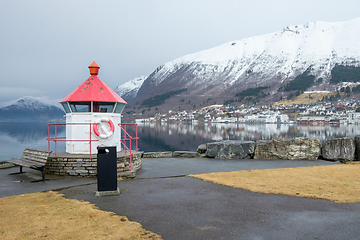 Image showing Picturesque Lighthouse Overlooking a Calm Lake in a Small Mounta