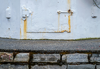 Image showing Weathered Wall With Rust Stains and Peeling Paint Close-Up on Ov