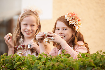 Image showing Girl, friends and tea cup in garden for party snack for happy dress up game, fantasy or play. Female people, nature and hot drink in backyard for summer bonding fun or lunch, birthday or beverage