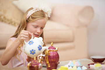 Image showing Girl, tea pot and party in home for birthday celebration fun or sweet dessert for dress up fancy game, play or snack. Female person, child and candy food in living room for holiday, event or lunch