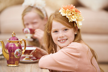 Image showing Girl, child and portrait with happiness at tea party in backyard for birthday, celebration and playing outdoor in home. Person, kid and face in garden of house with dress up, flower and role play fun