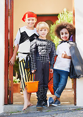 Image showing Children, halloween and celebration in costume or portrait in front yard, holiday and spooky outfit or tradition. Kids, face and role play with basket, fancy dress and happiness in garden of home