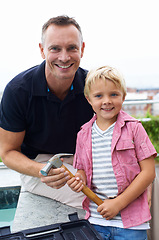 Image showing Hammer, smile and portrait of father with child for bonding together in backyard at family home. Happy, love and dad teaching maintenance or repairs to boy kid for quality time outdoor a house.