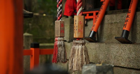 Image showing Location, torii gates and temple for religion, travel or traditional landmark closeup for spirituality. Buddhism, Japanese culture and trip to Kyoto, zen or prayer on pathway by Fushimi Inari Shinto