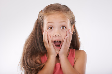 Image showing Girl, child with face and surprise, shock in studio with reaction or facial expression to drama and gossip. Wow, emoji and fear with story, info or announcement with portrait on white background