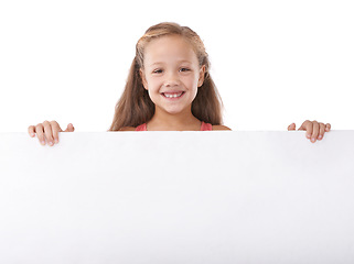 Image showing Poster, portrait and child advertising space, broadcast news and commercial presentation in studio on white background. Happy girl, kid and sign board for feedback, launch and information coming soon