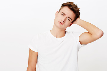 Image showing Confused, thinking and portrait of man scratching head in studio with why, asking or unsure on white background. Doubt, face and male model with questions, puzzled or gesture for guess, huh or memory