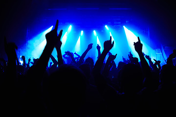 Image showing Nightclub, party and audience with hands or lights for music, concert or rave festival with spotlight and dancing. Disco, psychedelic event and performance with entertainment, crowd and mock up space