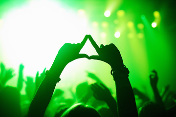 Image showing Triangle hands, neon and person in concert audience for music, festival or performance on stage. Party, psychedelic and green light with crowd of people outdoor for event, disco or club celebration