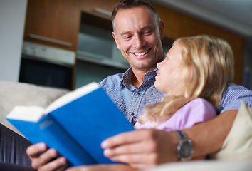 Image showing Father, child and reading a book for learning at home, story and fantasy fiction for education. Daddy, daughter and bonding together on sofa, literacy and storytelling for language development